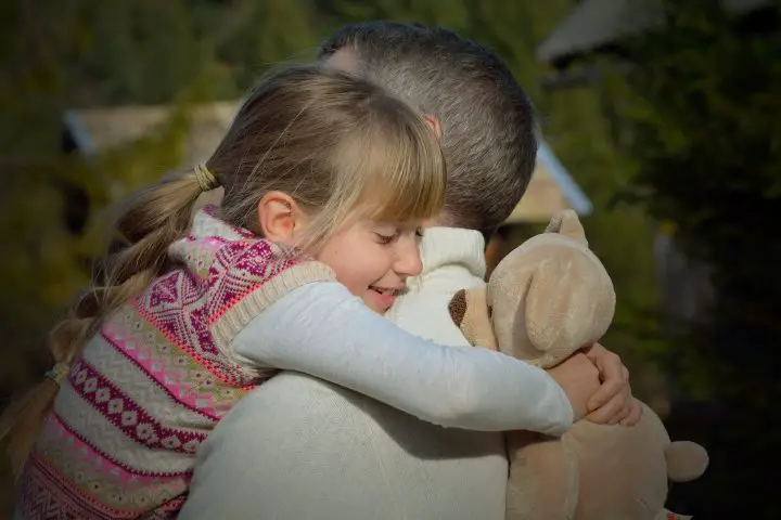 Father hugging his daughter