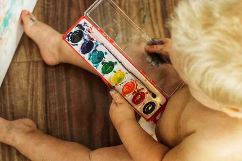 A child playing with paint