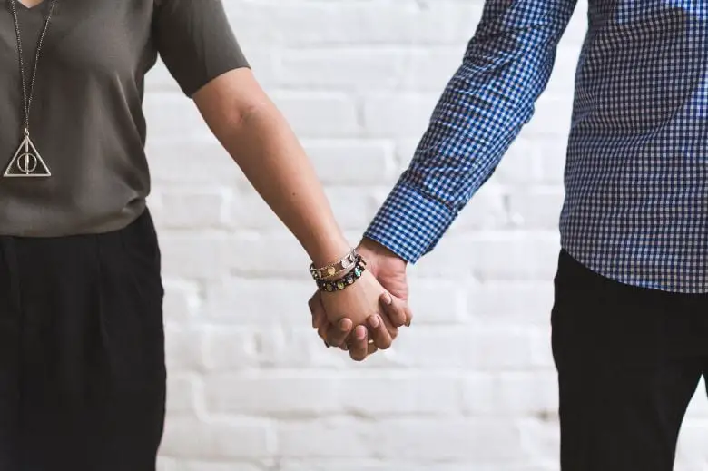 Man and woman holding hands