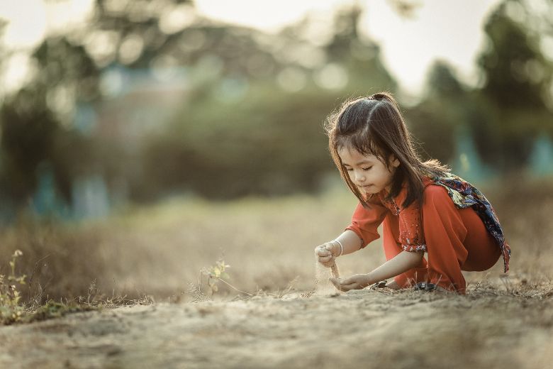 Girl playing with sand