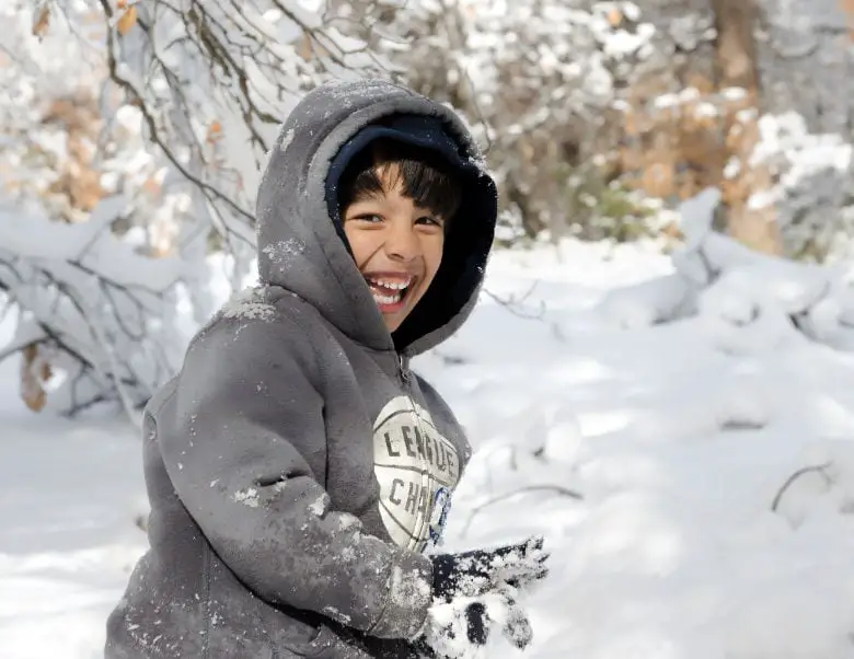 Boy playing with snow
