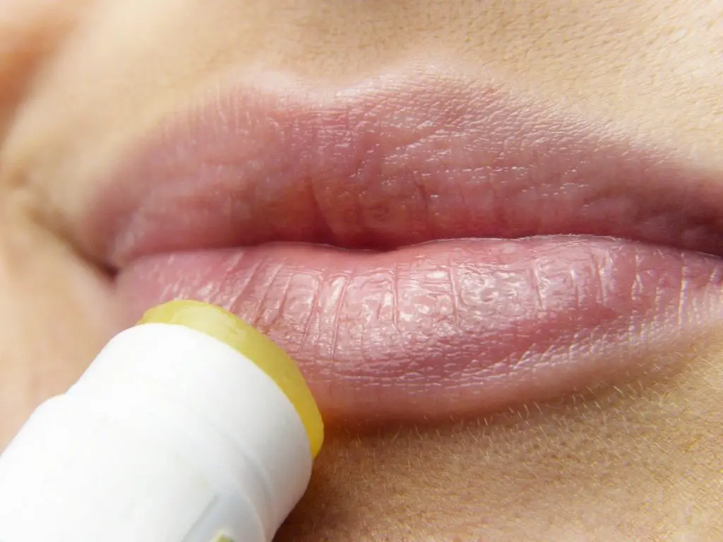 Lip balm being applied to lips