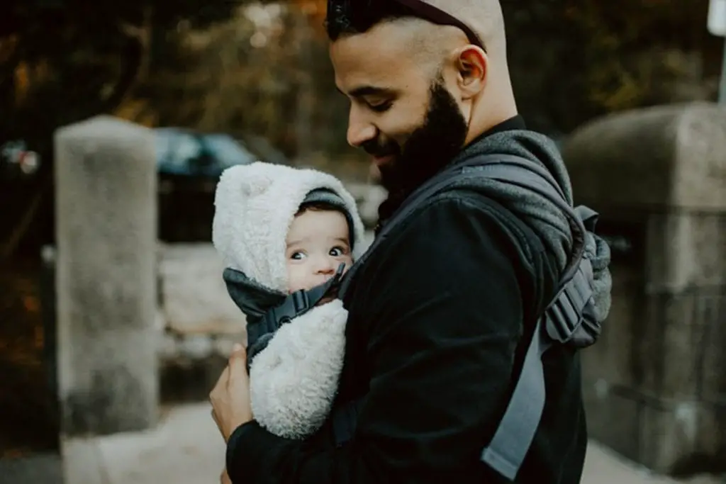 Father carrying his baby in a baby carrier