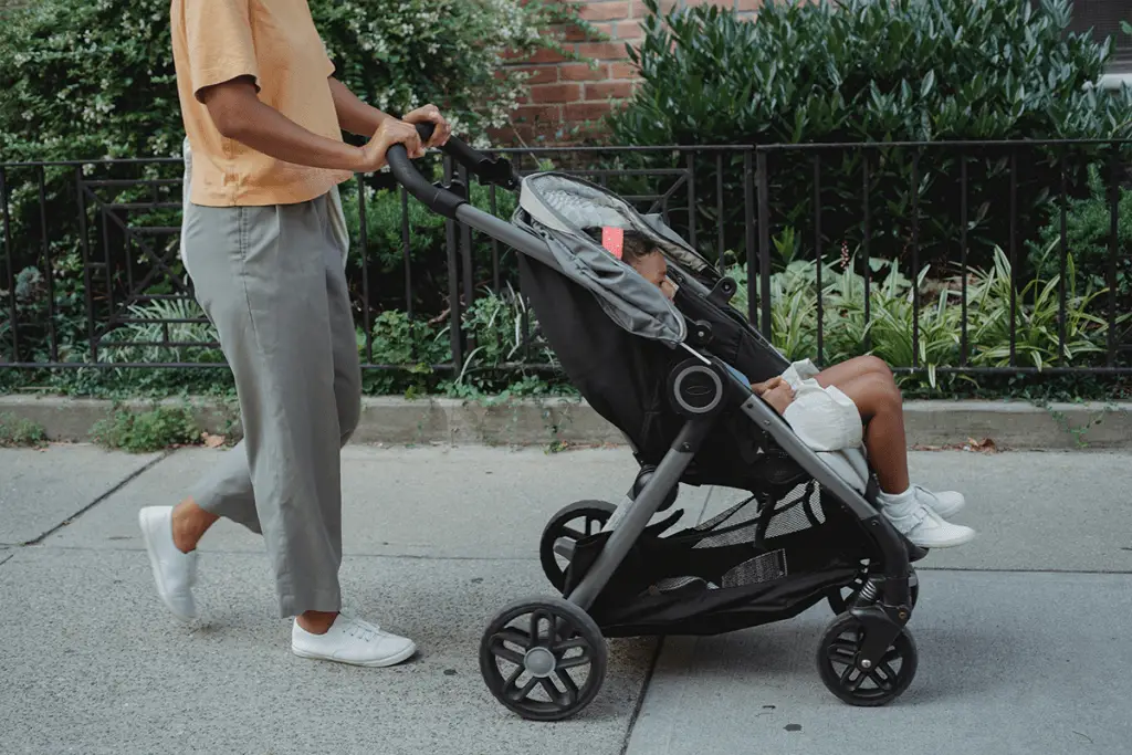 Father holding his son in stroller