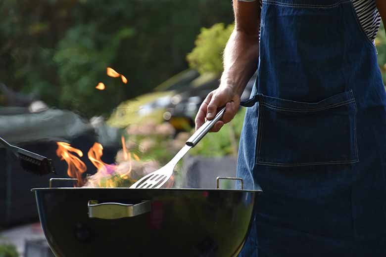 a man grilling the outdoor