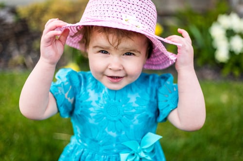 Baby girl wearing a pink hat