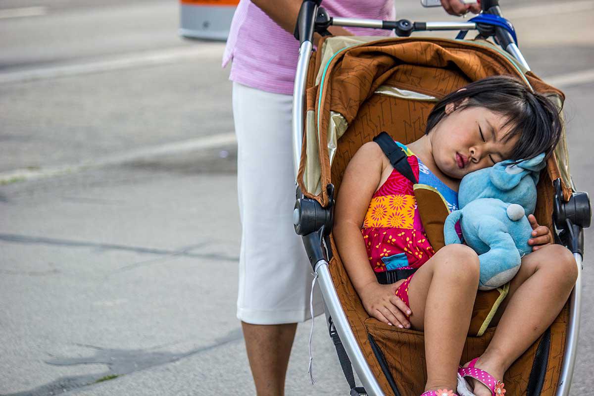 baby sleeping in stroller