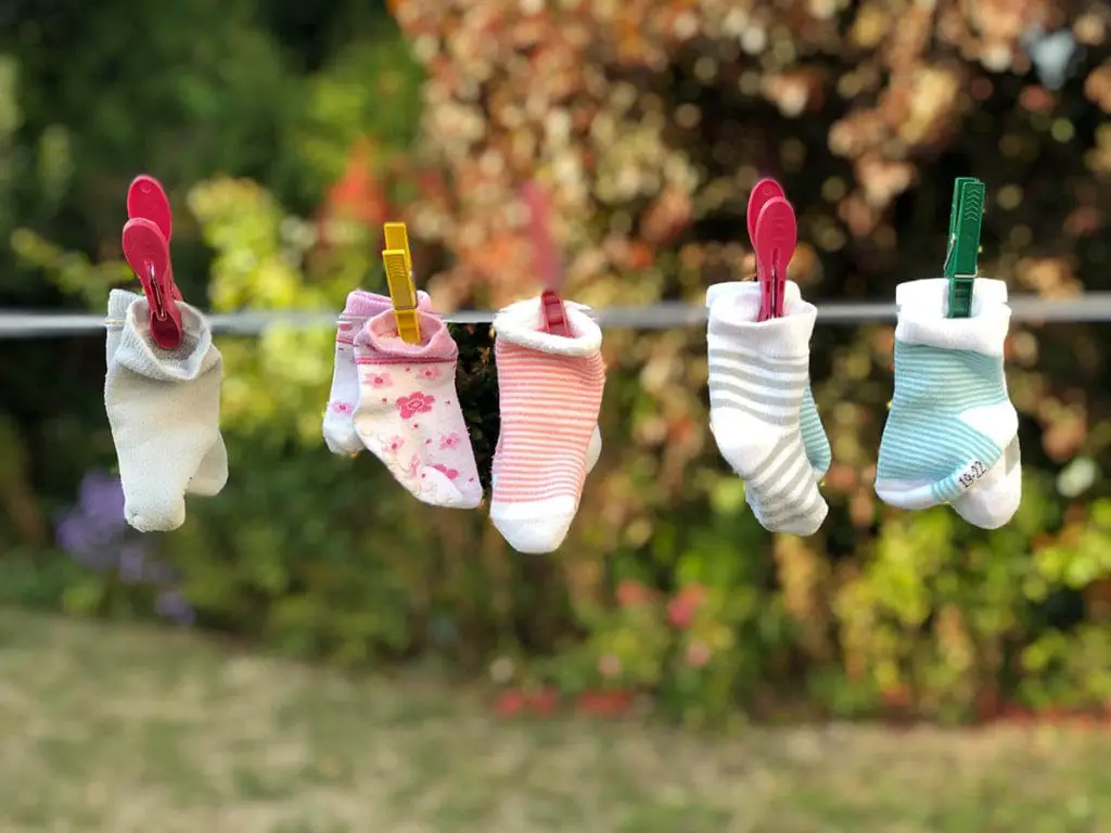 five pairs of socks hanging