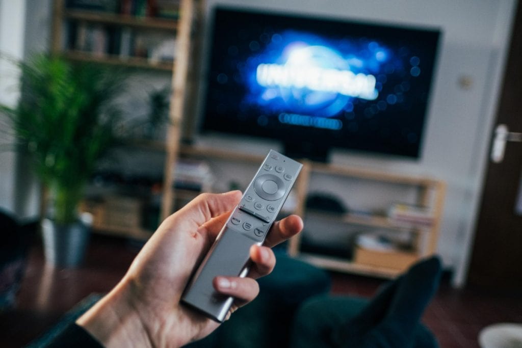 person holding a remote