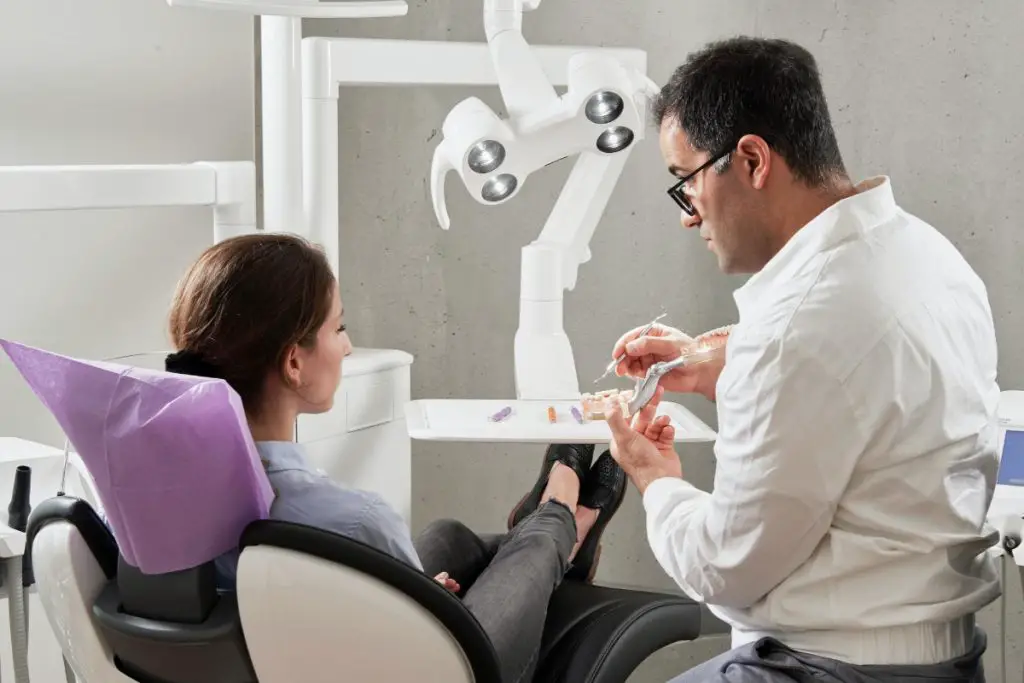 girl sitting with a dentist